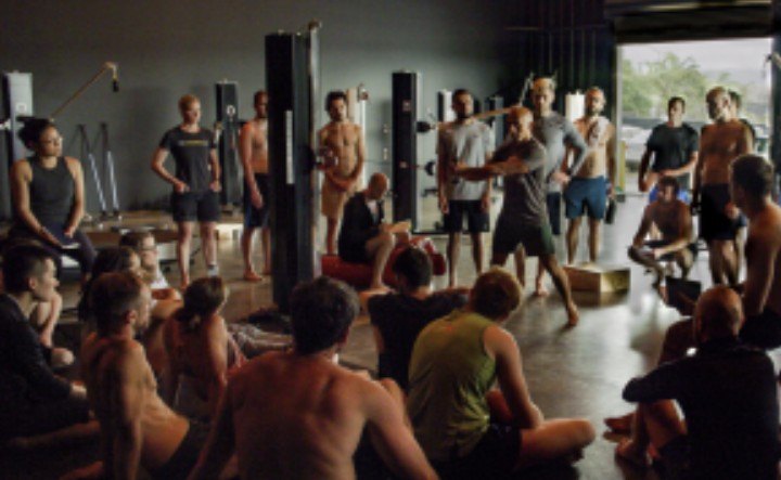 A Functional Patterns Human Biomechanic Specialist seminar in session, with practitioners seated around a demonstration.