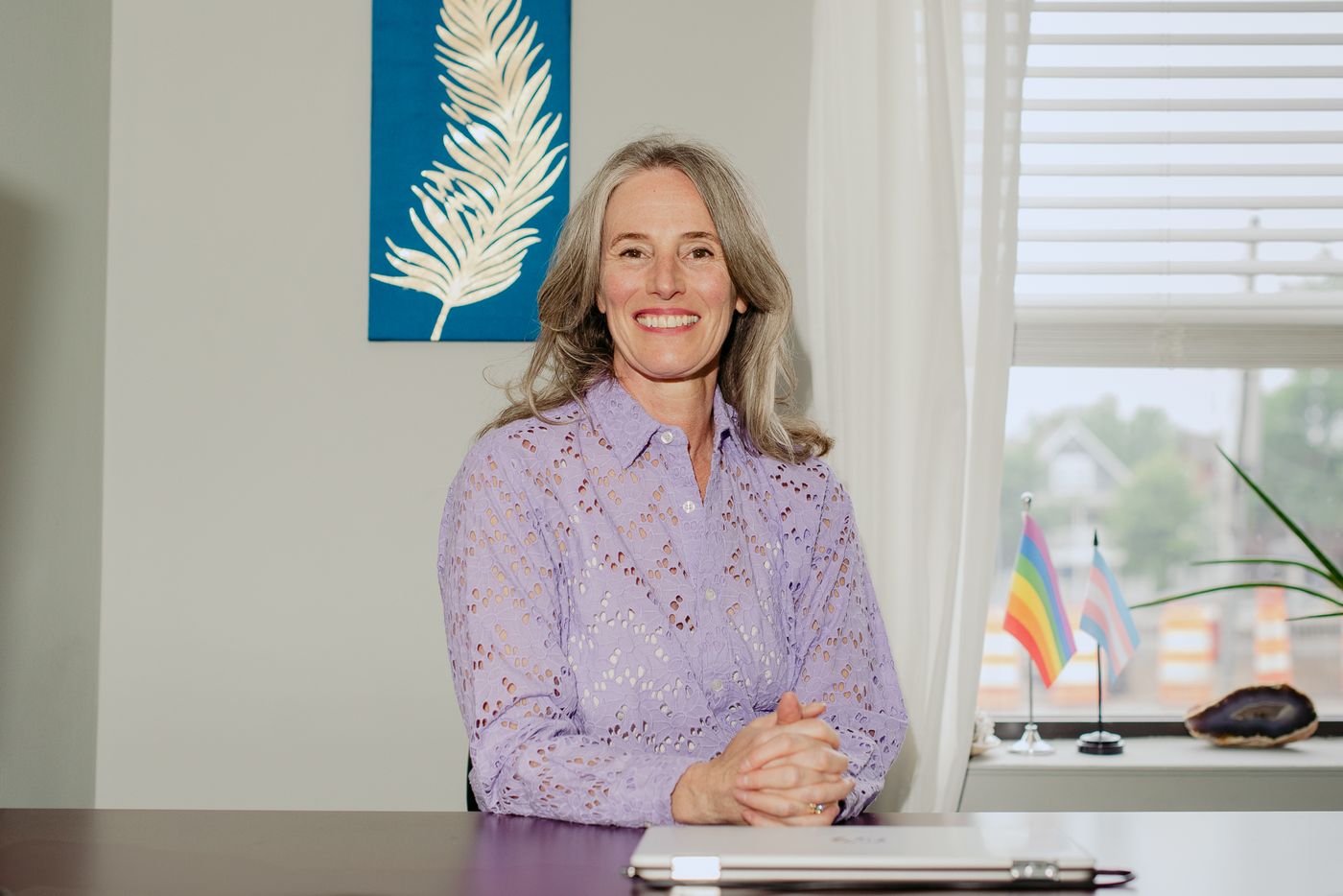 Dr. Kimberly Berkus seated at her desk in the Minneapolis office.